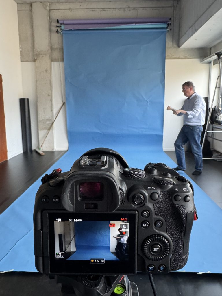 camera setup and blue backdrop used to record participants’ movements for the workshop dataset